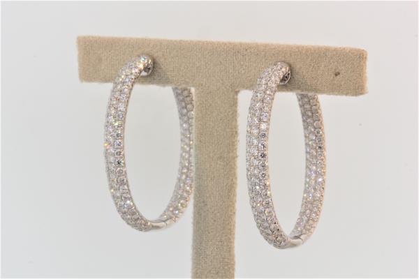 18k white gold diamond pave earrings with round brilliant cut diamonds weighing 6.74 carats total of F color, VS2 clarity.