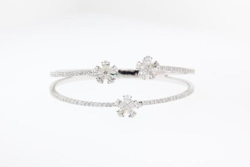 18k white gold diamond floral bangle bracelet featuring round brilliant cut diamonds weighing 3.73 carats total of F color, VS2 clarity.