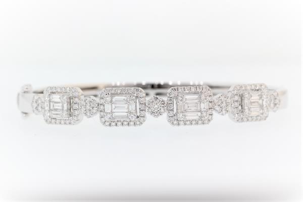 18k white gold diamond bangle bracelet featuring round brilliant cut and baguette cut diamonds weighing 1.98 carats total of F color, VS2 clarity.