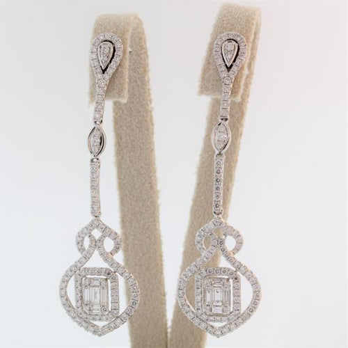 One pair of lady's handcrafted 18k white gold diamond drop earrings weighing 3.00 carats total of F color, VS2 clarity.