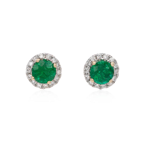 14k white gold diamond and emerald button earrings featuring 28 round brilliant cut diamonds weighing .12 carats total of F color, VS2 clarity, and of excellent cut and brilliance. Earrings also feature 2 emeralds weighing .66 carats of excellent cut, hue, and even color distribution.
