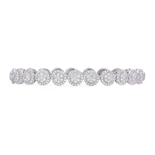 18k white gold diamond cluster bracelet featuring round brilliant cut diamonds weighing 4.68 carats total of F color, VS2 clarity, and of excellent cut and brilliance.   Bracelet measures 5mm.