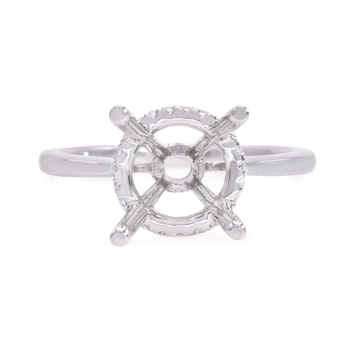 18k white gold diamond engagement ring setting featuring round brilliant cut diamonds weighing .15 carats total of F color, VS2 clarity, and of excellent cut and brilliance.