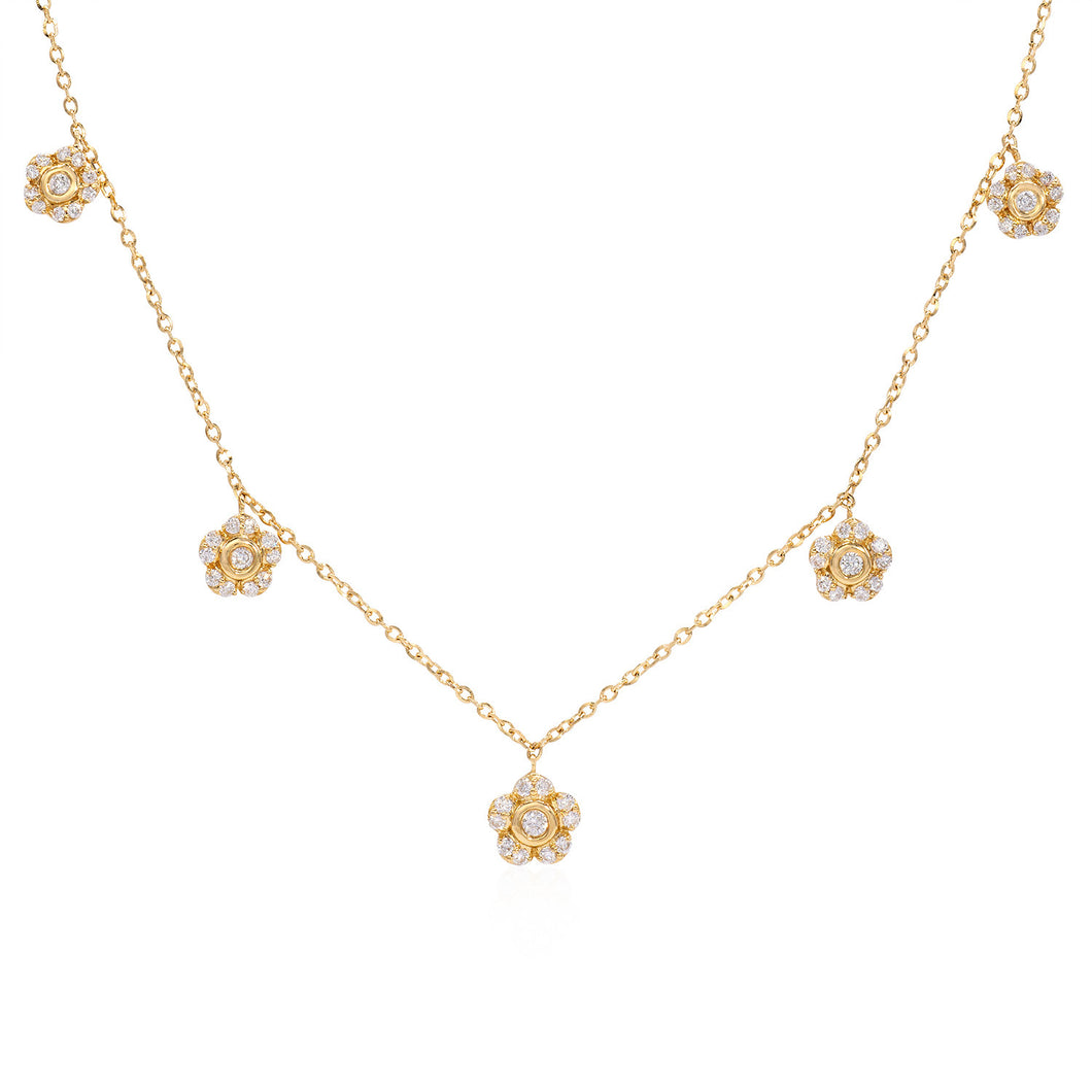 18k yellow gold diamond floral drop necklace featuring round brilliant cut diamonds weighing .29 carats total of F color, VS2 clarity, and of excellent cut and brilliance.  Necklace measures 18