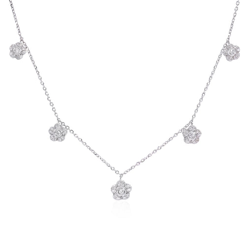 18k white gold diamond floral drop necklace featuring round brilliant cut diamonds weighing .29 carats total of F color, VS2 clarity, and of excellent cut and brilliance.     Necklace measures 18