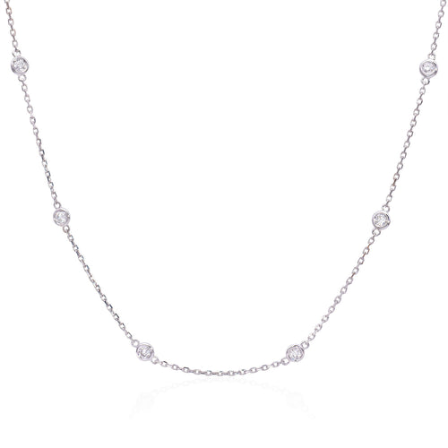 14k white gold diamonds by the yard necklace featuring round brilliant cut diamonds weighing .39 carats total of F color, VS2 clarity.     Necklace measures 18