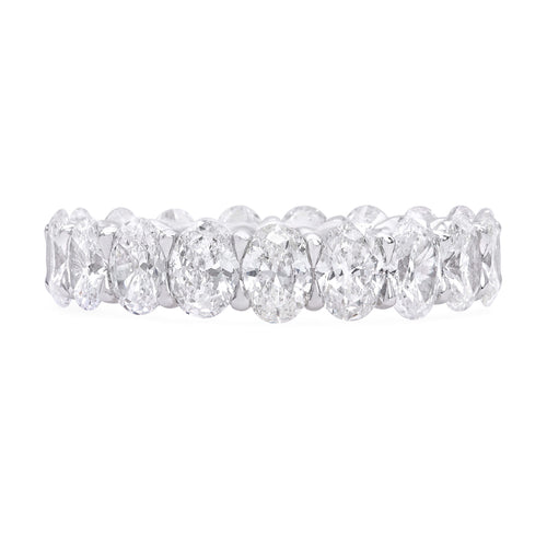 18k white gold diamond eternity band featuring 19 oval brilliant cut diamonds weighing 4.16 carats total of F color, VS2 clarity, and of excellent cut and brilliance.